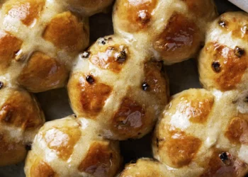 Bourbon-plumped currants enhance the flavor of hot cross buns